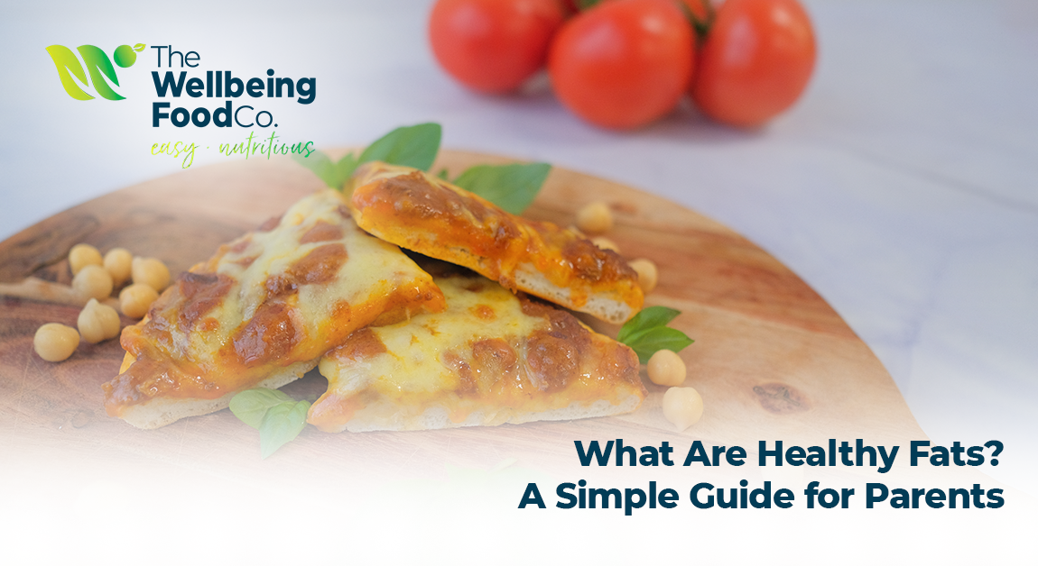 Healthy foods rich in unsaturated fats, including avocado, nuts, seeds, and salmon arranged on a table.